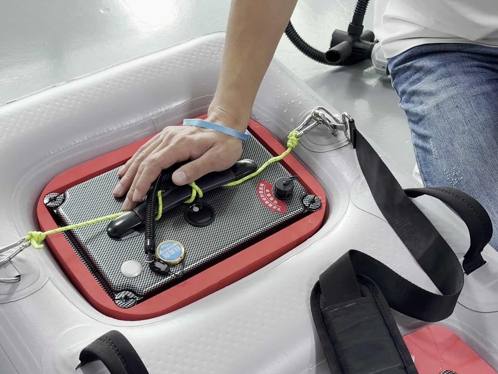 Gauge, hose and straps on the deck of an inflatable dive platform